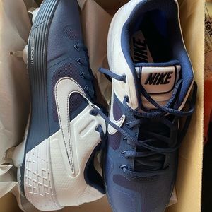 Navy blue metal baseball cleats